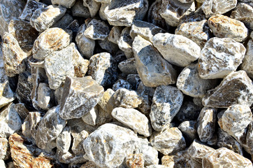 Natural gray gypsum stone. Close up image of stones with black and white. Industrial mining area. Limestone mining, quarry - Image