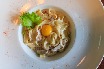 close up noodles with yolk