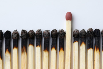 New intact match standing out from plenty burned fellows