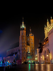 Fototapeta premium Historic ancient market square in Krakow. Cloth Hall and Mariacki Church