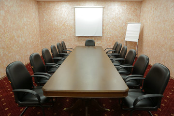 Prepared conference room for guests, with red carpet, clean, cozy, bright