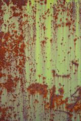 Old rusted metal texture. The surface of an uneven green iron wall. Perfect for background and grunge design.