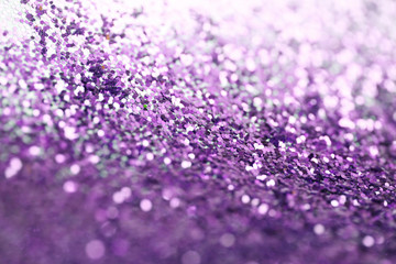 Violet glitter shine dots confetti. Abstract light blur blink sparkle defocus background.