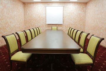 Prepared conference room for guests, with red carpet, clean, cozy, bright