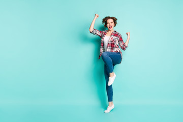 Full length photo of enthusiastic girl win lottery raise fists scream yeah wear casual style clothing isolated over green color background