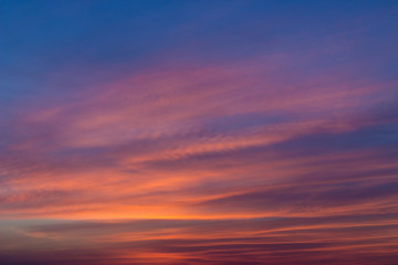 Bright colorful sky with cirrus clouds during sunrise