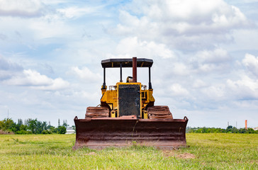 Old rusty tractor in field