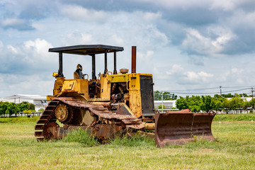 Old rusty tractor in field