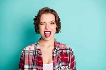Obraz na płótnie Canvas Close up photo of crazy funky girl enjoy free cool time fooling show tongue out wink blink wear good looking outfit isolated over pastel color background