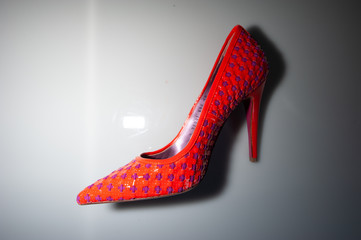 red shoes on a black background