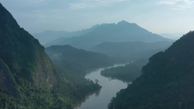 Aerial view of mountains and river Nong Khiaw. North Laos. Southeast Asia. Photo made by drone from above. Bird eye view.