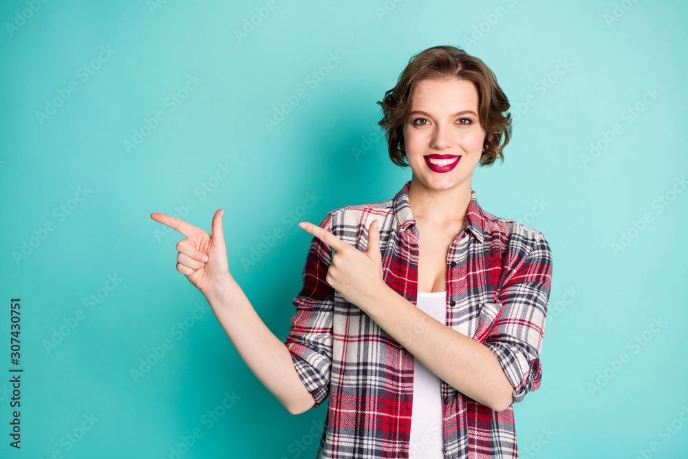 Canvas Prints Portrait of positive cheerful girl point index finger copy space direct present promotion adverts wear stylish clothing isolated over turquoise color background