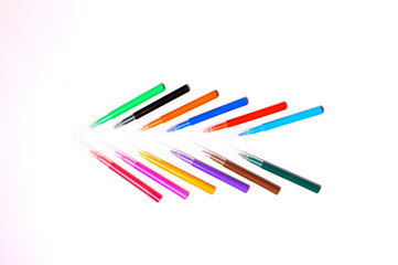 Colorful felt-tip pens on the white background. Markers and pencils pattern. Background or texture.
