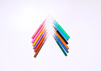 Colorful felt-tip pens on the white background. Markers and pencils pattern. Background or texture.