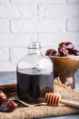 Homemade syrup from dates. Alternative food and drink trend food Vertical