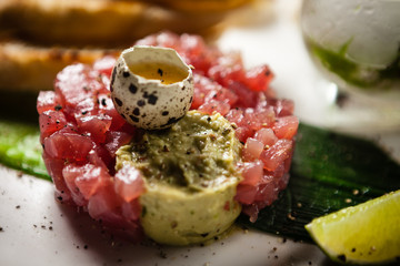 Tuna tartare served on a plate in restaurant
