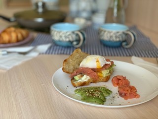 Croissant with salmon, avocado and poached egg