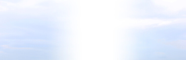 Light blue and white sky background. Bright sky texture with small clouds, wide horizontal mockup with blank white copy space 