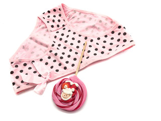 Lollipop and pink underpants isolated on white background. Composition of coward and candy. Lollipop with Santa Claus and coward to the point.