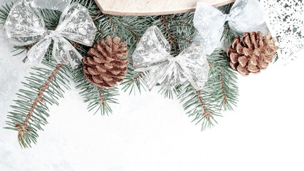 Christmas creative background border, gold color, cones, branches, place for text