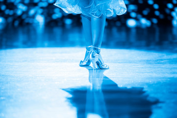 Woman dancer latino international dancing. Blue filter