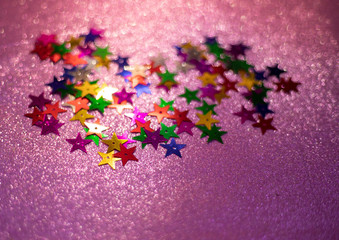 shiny star glitters on pink background