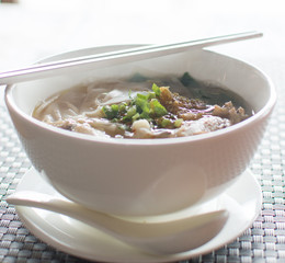thai chicken noodles  on table