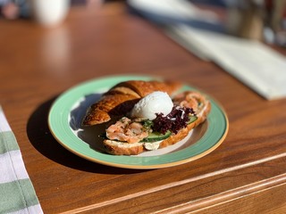Croissant with salmon and poached egg