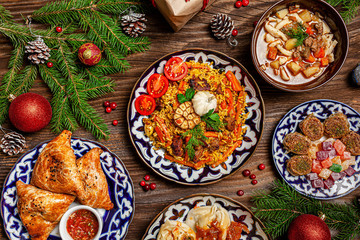 Traditional Uzbek oriental cuisine. Uzbek family table from different dishes for the New Year...