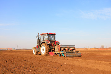 Obraz premium sowing machines sow peas on a farm, Luannan, Hebei, China