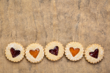 jam heart biscuits on textured paper