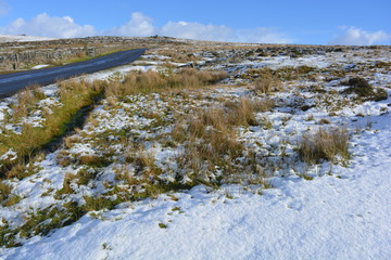 Road over the moors, Dartmoor National Park in winter with snow, Devon, England