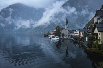 Beautiful landscapes in Hallstatt in a foggy day, a Lakeside Village in dusk, Austria