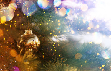 Christmas and New Year holidays background. Glitter lights backdrop. Winter season. Text space. Closeup of Christmas-tree.