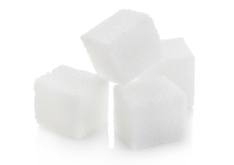 Close-Up shot of natural white sugar cubes on white background.
