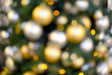 Fototapeta na wymiar Blurry New Year and Christmas lights and Christmas toys