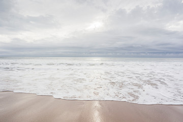 Ocean, sea, sand beach with black clouds on horizon. Zen picture (France-Vendée-Les Sables-d'Olonne)