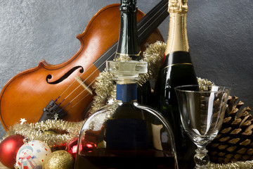 New Year's card with violin and bottles of champagne and liquor