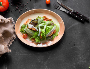 Grilled squid or stir-fried squid with vegetable ,squid salad. Place for text on wooden rustic background top view. Place for text on wooden rustic background top view.