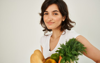 young woman with vegetables isolated on white