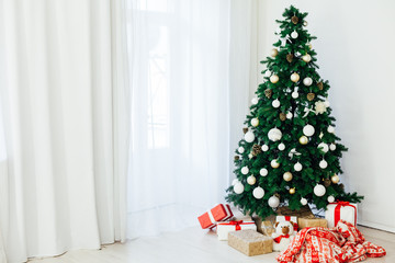 Christmas tree with red decor gifts for the new year holiday winter