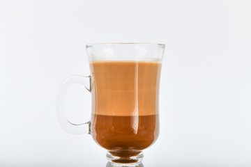cocoa Poured into a glass transparent glass. Cocoa drink on a white background.