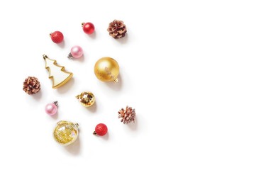 Flat lay photography Christmas and New Year ornament. Gold, pink, red balls , pine cones. Classic elegant Xmas decoration