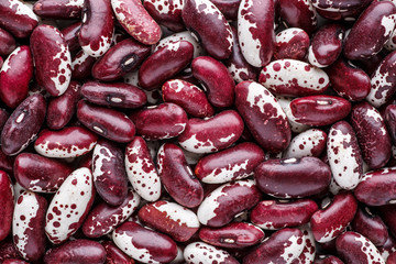 Beans of bean ( beans ).Texture of violet with dots beans.Beans handsome.Swallow beans.Cocnept textures of legumes,Vegetables for diet and healthy eating.Organic food.