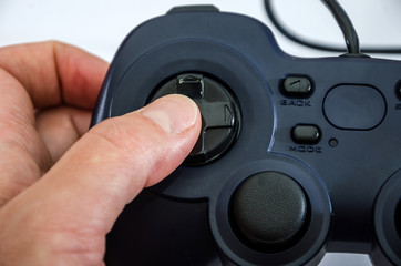 gamepad in hand, close-up. Play by hand.