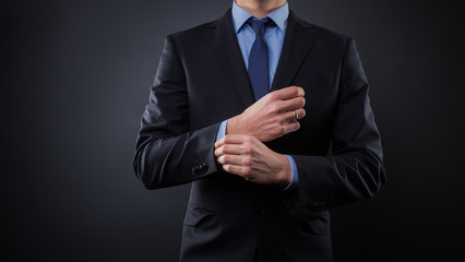 Obraz na płótnie Canvas Man in black blue suit with tie