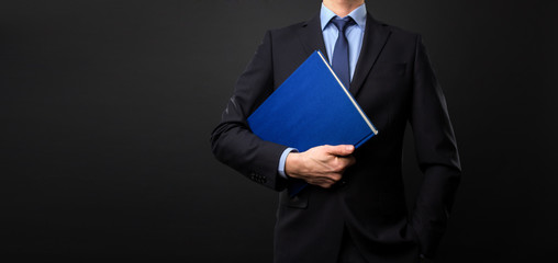 Business Man with book in his hand