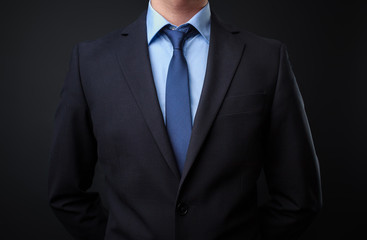 Man in black blue suit with tie