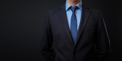Man in black blue suit with tie