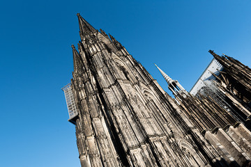 Fototapeta na wymiar World famous Cologne Cathedral also called Kölner Dom in Cologne, Germany with blue sky
